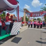 Camat Taman Arie Prabowo, S.STP, M.PSDM berangkatkan peserta gerak jalan peringati HUT RI Ke-80.